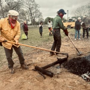 Ken Carloni and Maggie Craig demonstrate biochar production at the Ag Hall in 2024. Photo by Karmen Ohme.